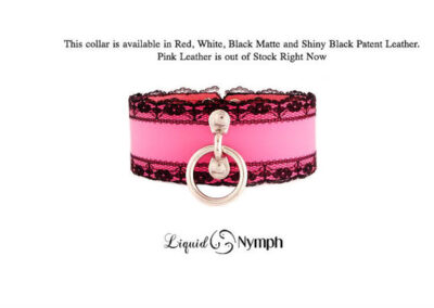 Pink and black lace collar with ring.