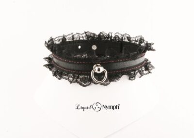 Black lace choker with metal ring.