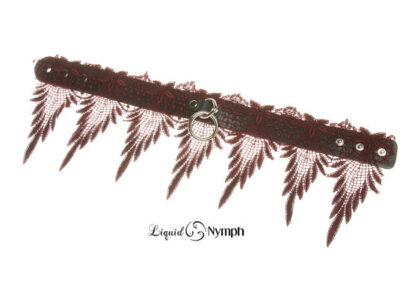 Red lace choker with feather-like fringe.